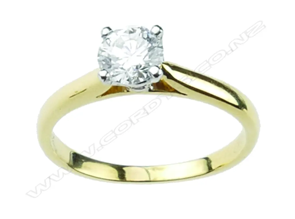 An 18ct gold and diamond solitaire ring Image 1++