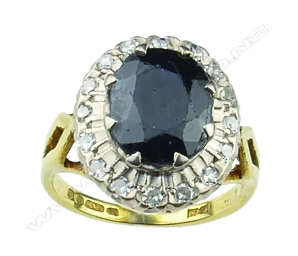 An 18ct gold sapphire and diamond cluster ring Image 1++