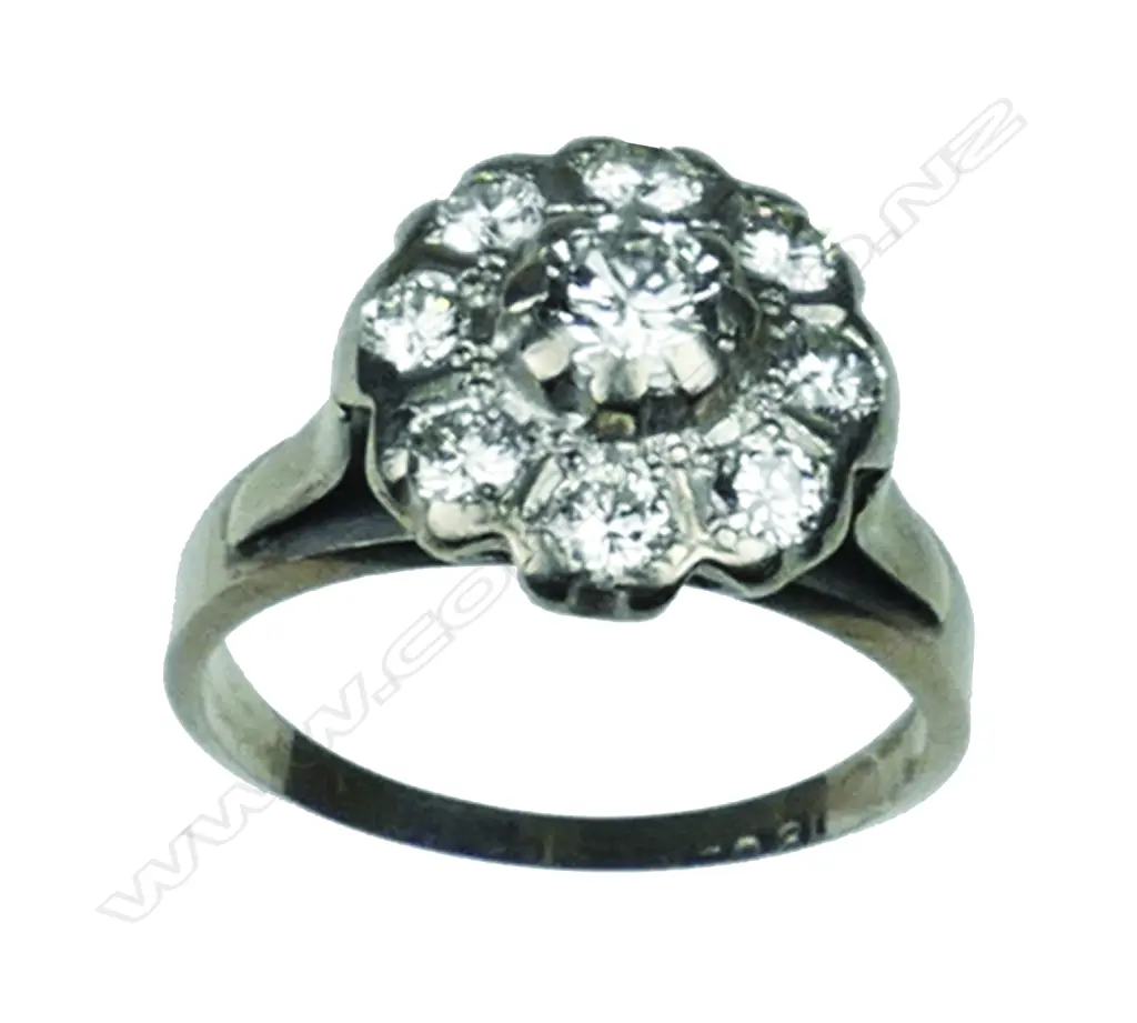 An 18ct. white gold diamond cluster ring Image 1++