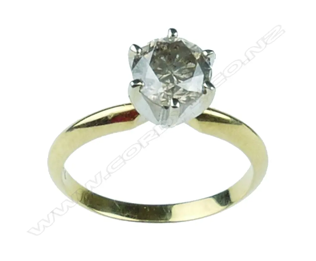 A 14ct gold and diamond solitaire ring Image 1++