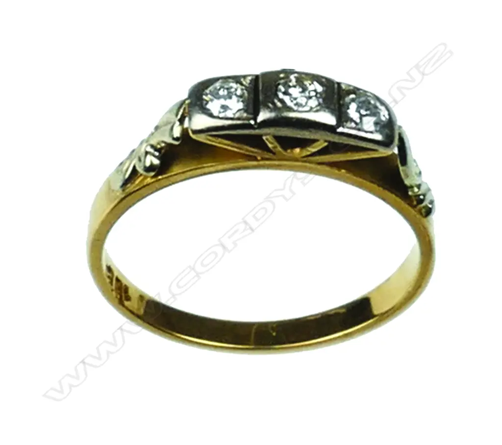 An 18ct. gold and three stone diamond ring Image 1++