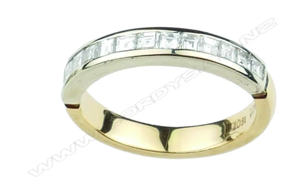 A lady's modern 18ct. white and yellow gold and diamond eternity ring Image 1++