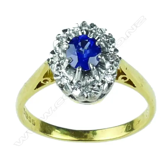 An 18ct. gold sapphire and diamond cluster ring