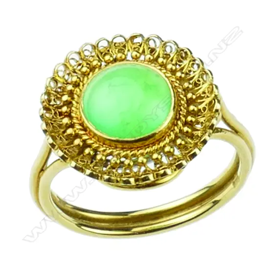 An 18ct. yellow gold and green jade ring