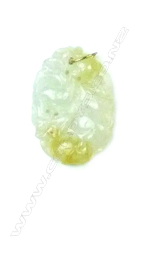 A Chinese pale jade carved pendant with 14ct. gold loop suspension Image 1++