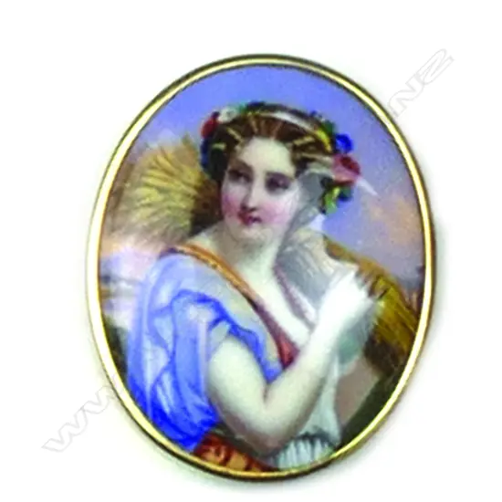 A gold framed 19thC Swiss enamelled portrait brooch