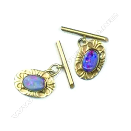 A pair of 9ct gold and opal cuff links