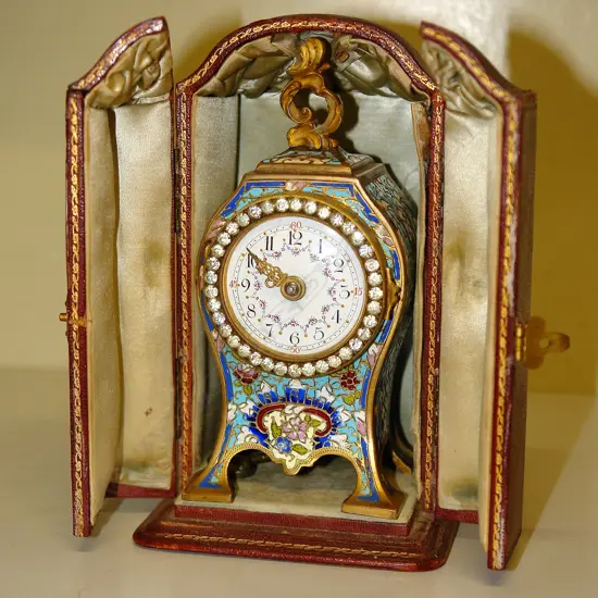 A 19thC French ormolu and champleve enamel small bombe mantel clock