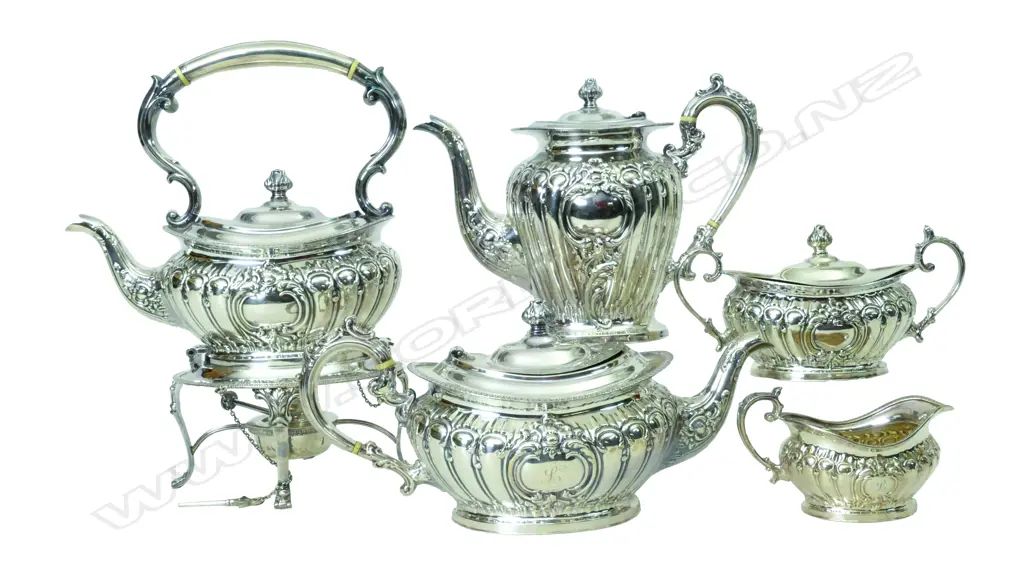 A mid-20thC quality five-piece tea and coffee service including spirit kettle Image 1++