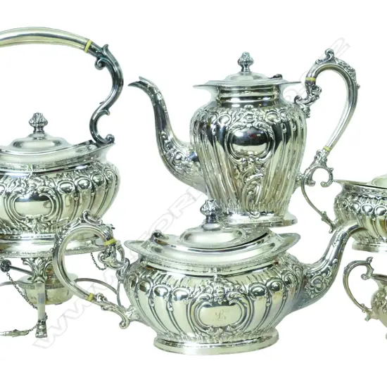 A mid-20thC quality five-piece tea and coffee service including spirit kettle