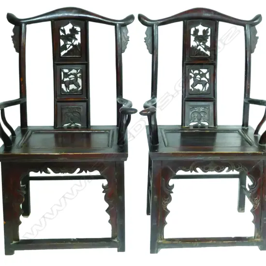 A pair of old Chinese yoke back Emperor and Empress chairs with wide carved and pierced splats