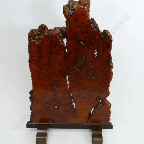 A slab of Chinese hardwood burl (huali) as a room stand