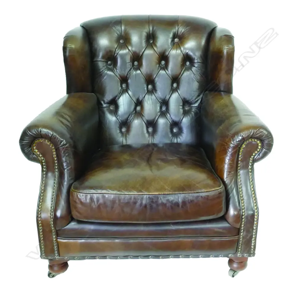 A pair of dark brown leather club chairs Image 1++