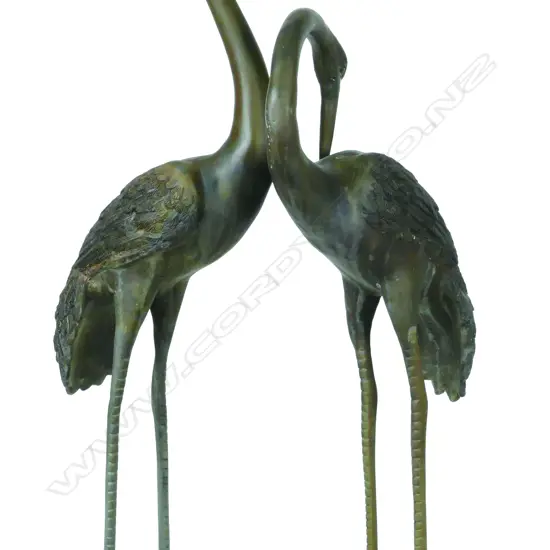 A pair of Japanese early 20thC bronze heron sculptures