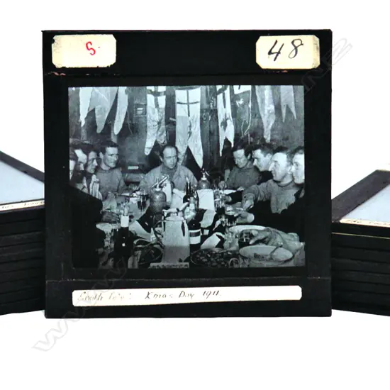 A box of early 20thC 'The South Pole' glass lantern slides