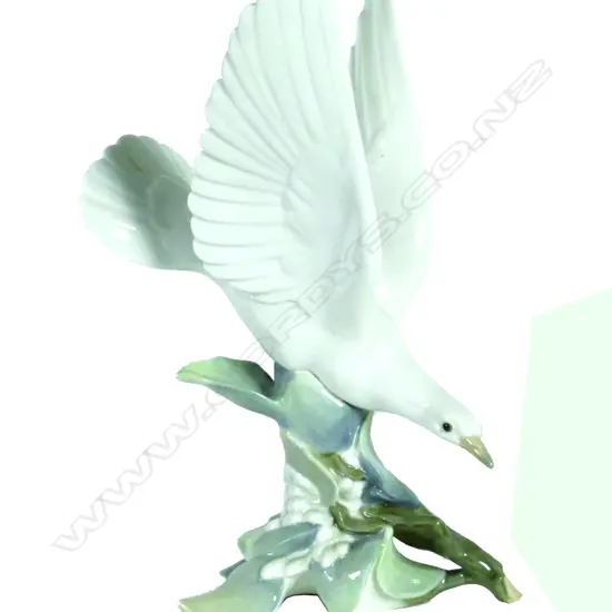 A Lladro figurine of a dove