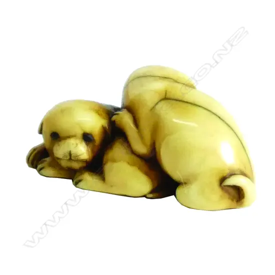 A 19thC Japanese carved ivory netsuke of two pups