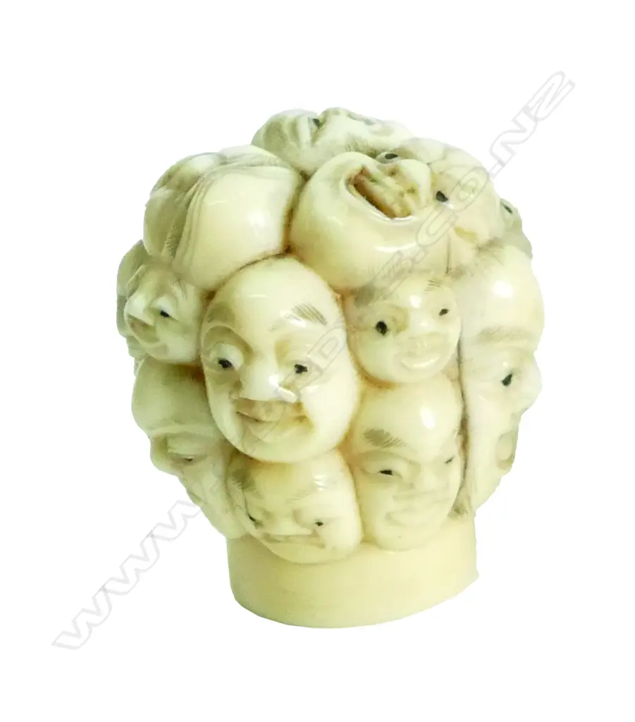 A Japanese Meiji period multi-face carved ivory cane handle Image 1++