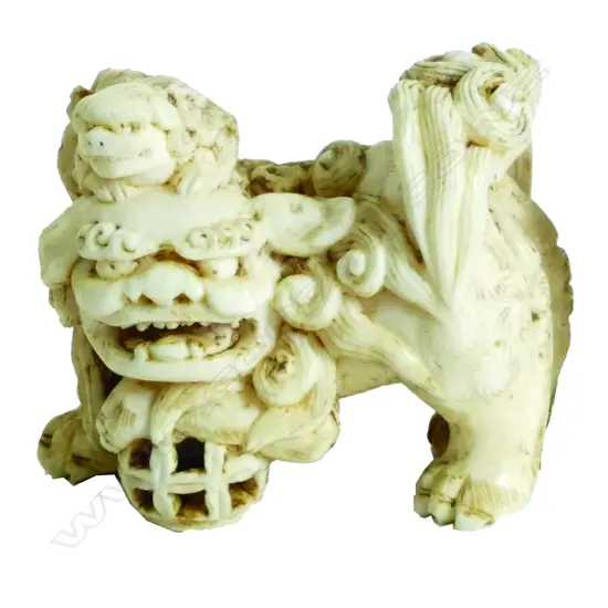 An old Chinese finely carved ivory shishi figure