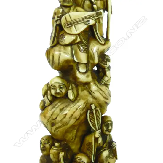 An Oriental carved ivory tusk end section