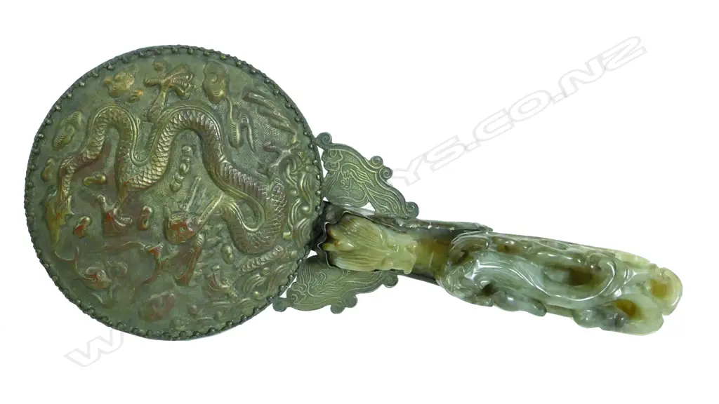 An old Chinese belt buckle handled hand mirror Image 1++