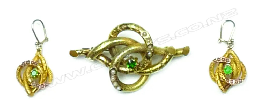 A Victorian 9ct. gilded yellow gold seed pearl and green stone decorative brooch and earring suite Image 1++