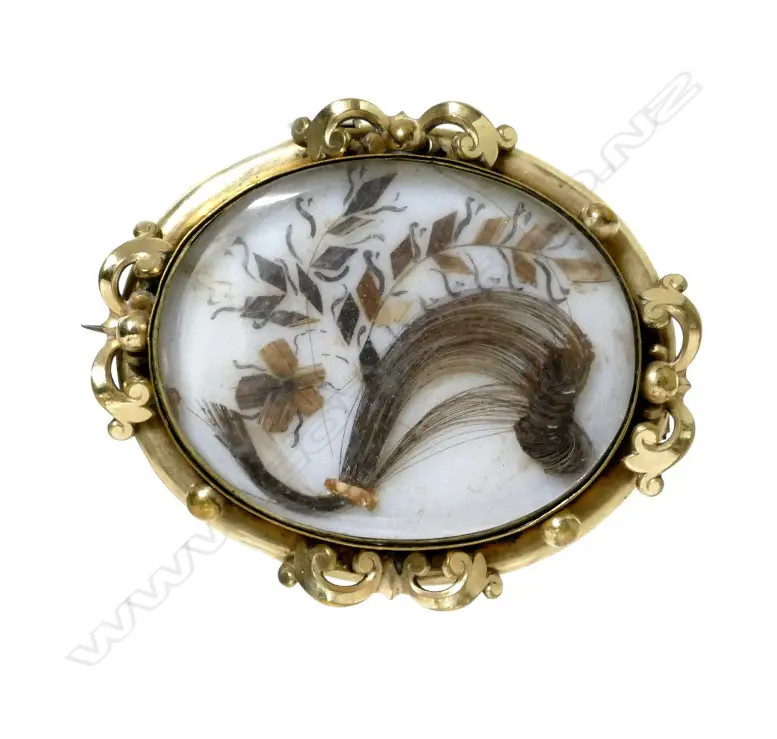A Victorian large oval mourning brooch Image 1++