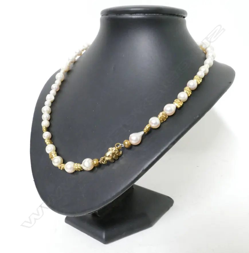 A 14ct. yellow gold and semi-baroque cultured pearl necklace Image 1++