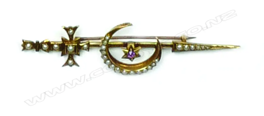 An Edwardian 15ct. yellow gold and seed pearl sword and crescent bar brooch Image 1++