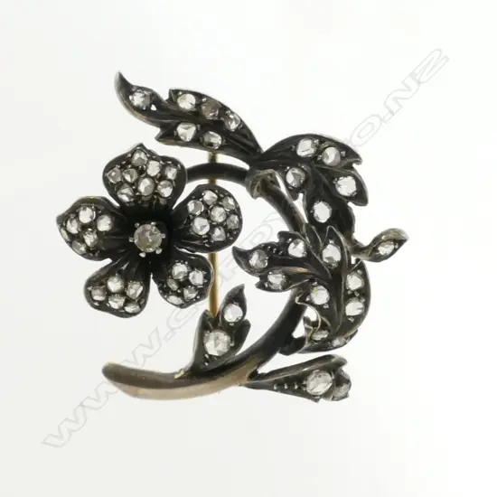 A 14ct. gold and diamond brooch