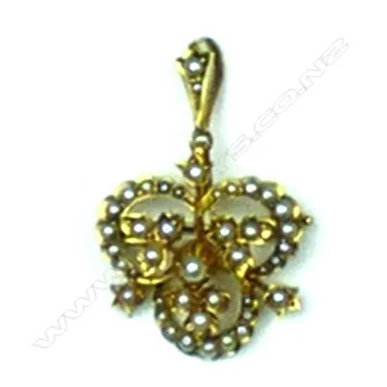 An Edwardian 15ct. yellow gold and seed pearl pendant brooch