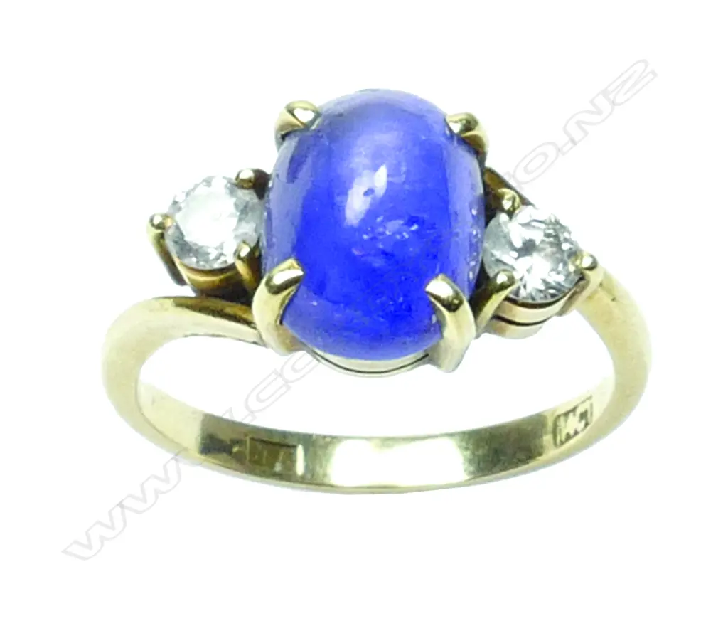 A 14ct. gold star sapphire and diamond ring Image 1++