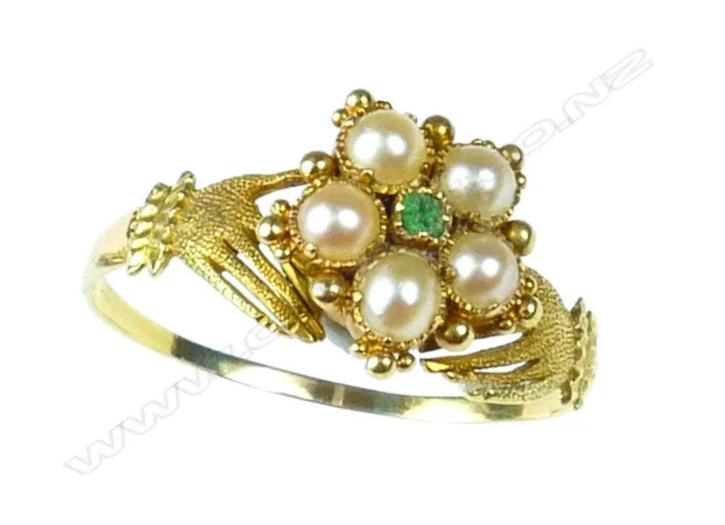A 19thC 18ct. yellow gold emerald and seed pearl hands ring Image 1++