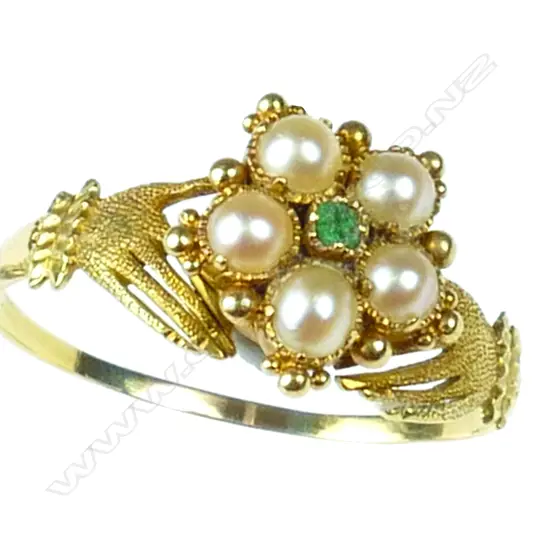 A 19thC 18ct. yellow gold emerald and seed pearl hands ring