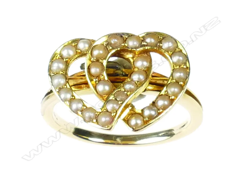An Edwardian 18ct. yellow and rose gold and seed pearl double heart ring Image 1++