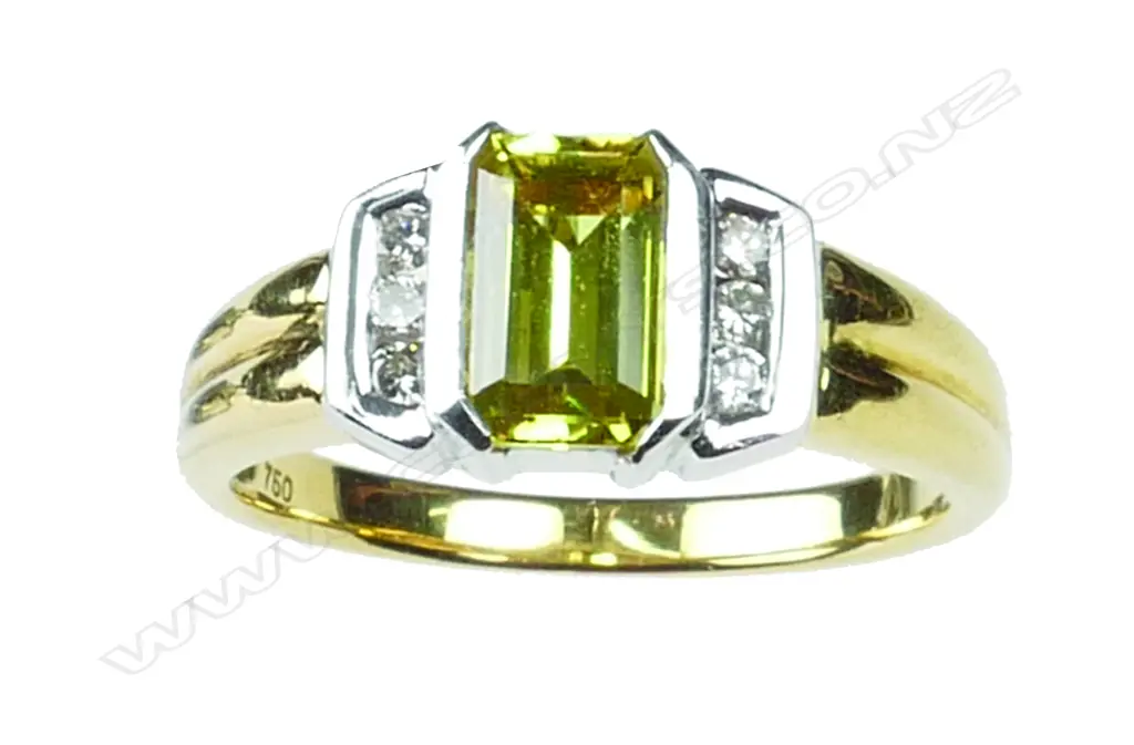 An 18ct. yellow and white gold yellow sapphire and diamond ring Image 1++