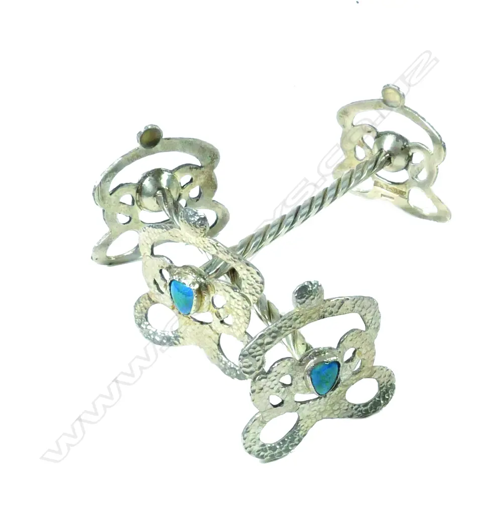 A pair of Reuben Watts N.Z. Arts & Crafts silver knife rests Image 1++