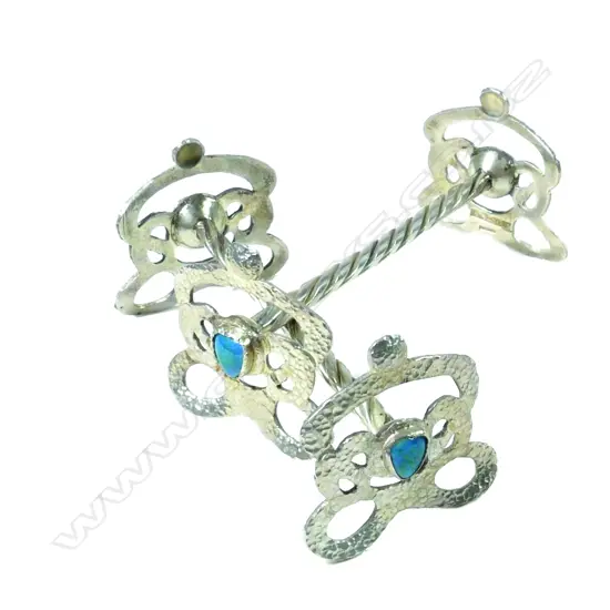 A pair of Reuben Watts N.Z. Arts & Crafts silver knife rests