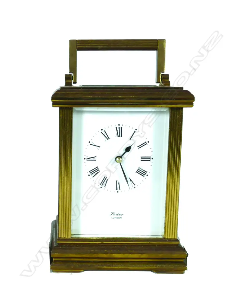 A brass cased carriage clock Image 1++