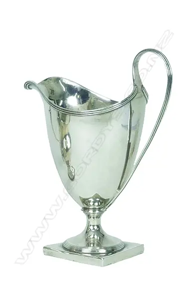A George III silver helmet shaped cream jug Image 1++