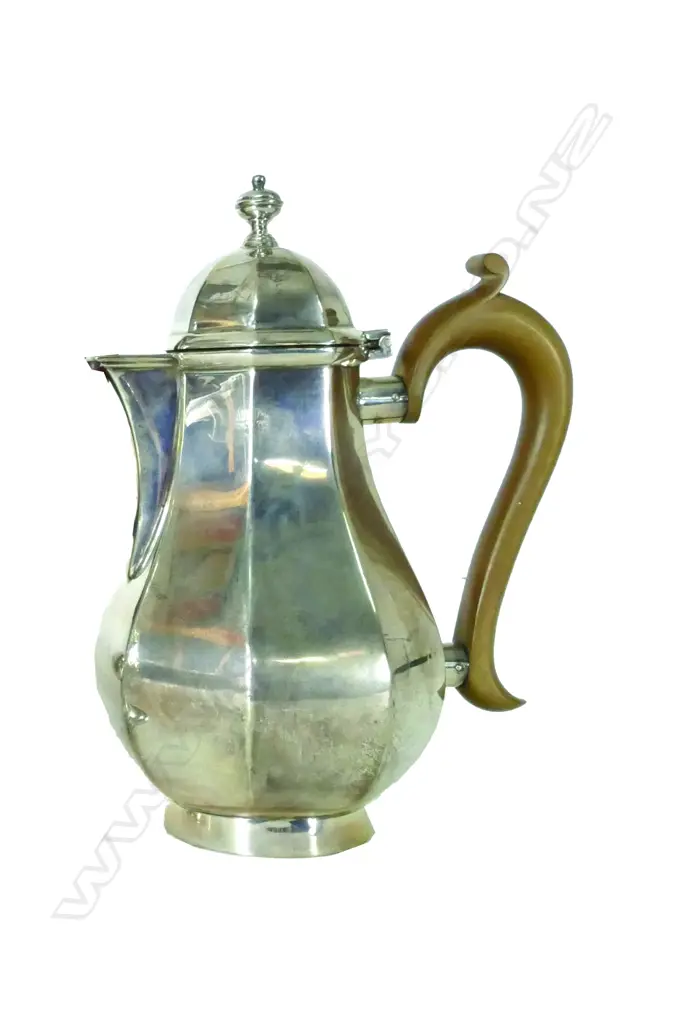 A silver coffee or chocolate pot Image 1++