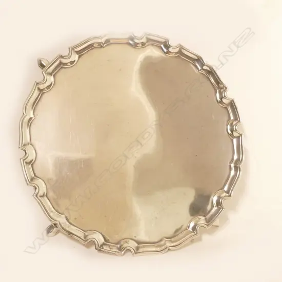 A silver Georgian Revival pie-crust waiter