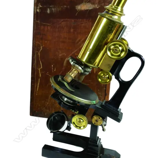 A 19thC Leitz Wetzlar brass and black enamel monocular microscope with interchangeable lenses