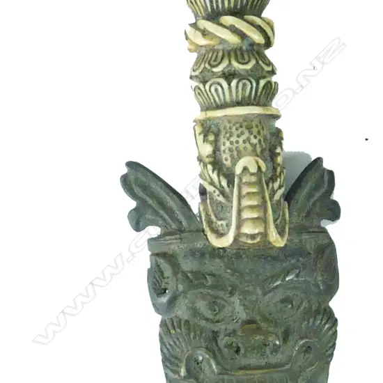 An old Tibetan carved bone and horn demon dagger