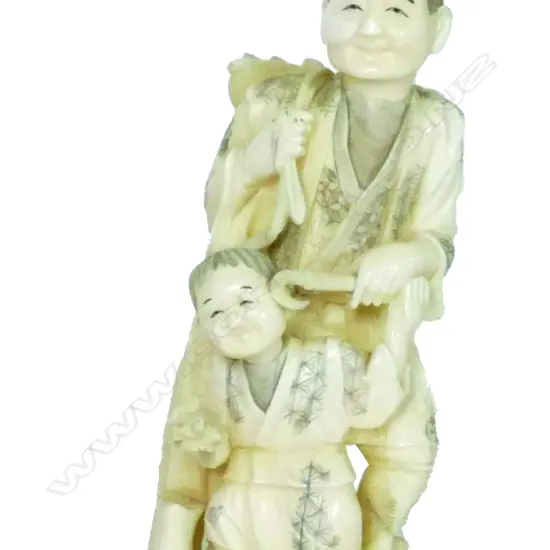 A Japanese marine ivory carving of a peasant gatherer and child.  Their garments engraved with diaper patterns