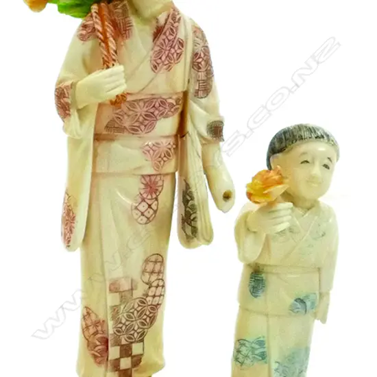 A Japanese carved ivory figure group of a mother and child