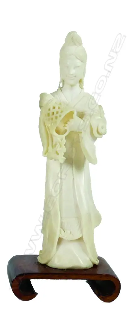 A Chinese carved ivory figure of a female deity Image 1++