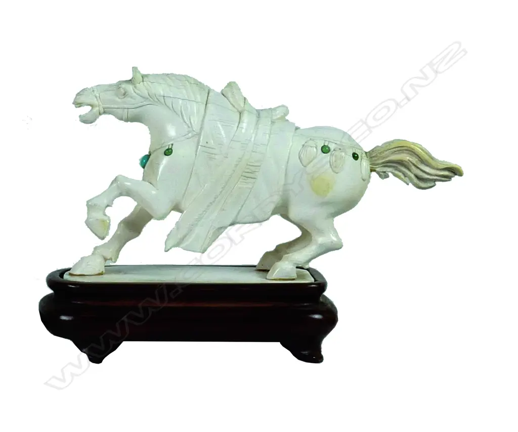 An old Chinese carved ivory horse modelled with one leg raised and in back leaning stance Image 1++