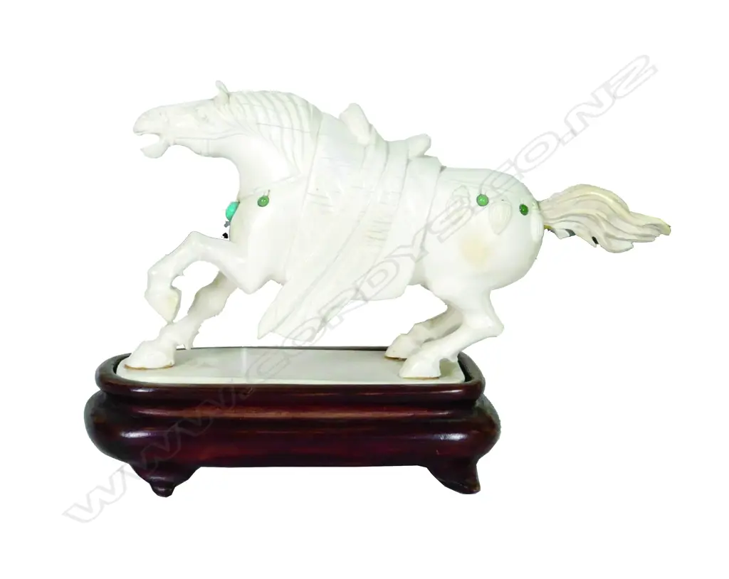 An old Chinese carved ivory horse modelled with one leg raised and in back leaning stance Image 1++
