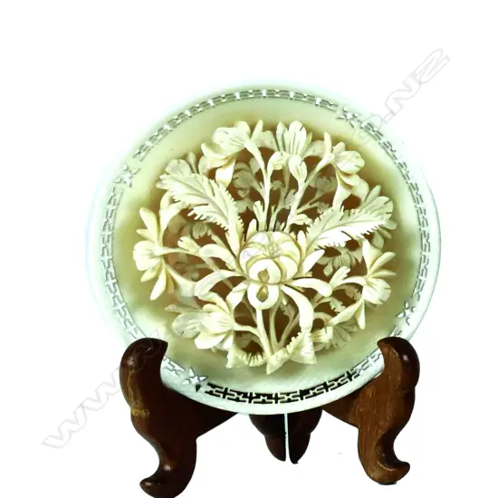 A small finely carved ivory plaque